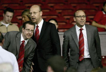 MANCHESTER, ENGLAND-AUGUST 9 : (L to R) Joel Glazer, Avram Glazer and Bryan Glazer, sons of owner Malcolm Glazer, are seen before the Champions League third qualifying round, first leg match between Manchester United and Debreceni VSC at Old Trafford on August 9, 2005 in Manchester, England.  (Photo by Clive Brunskill/Getty Images)