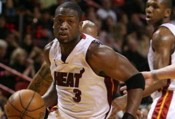 MIAMI - MAY 01:  Dwyane Wade #3 of the Miami Heat penetrates against the Atlanta Hawks during Game Six of the Eastern Conference Quarterfinals at American Airlines Arena on May 1, 2009 in Miami, Florida. NOTE TO USER: User expressly acknowledges and agrees that, by downloading and/or using this Photograph, user is consenting to the terms and conditions of the Getty Images License Agreement.  (Photo by Doug Benc/Getty Images)