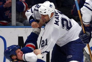 NEW YORK - OCTOBER 17: Jamal Mayers #21 of the Toronto Maple Leafs and Marc Staal #18 of the New York Rangers battle on October 17, 2008 at Madison Square Garden in New York City. (Photo by Bruce Bennett/Getty Images)