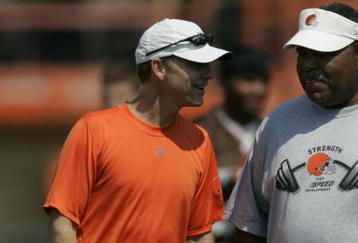 BEREA, OH - JUNE 16:  Head coach Romeo Crennel of the Cleveland Browns talks with Phil Savage, the Browns' senior vice president and general manager during a mini camp at the Cleveland Browns Training and Administrative Complex on June 16, 2006 in Berea, Ohio.  (Photo by Gregory Shamus/Getty Images)