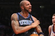 NEW YORK - NOVEMBER 09:  Carlos Boozer #5 of the Utah Jazz celebrates defeating the New York Knicks at Madison Square Garden on November 9, 2009 in New York City. NOTE TO USER: User expressly acknowledges and agrees that, by downloading and or using this photograph, User is consenting to the terms and conditions of the Getty Images License Agreement.  (Photo by Nick Laham/Getty Images)