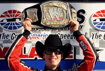 FORT WORTH, TX - NOVEMBER 07:  Kyle Busch, driver of the #18 Z-Line Designs/WWE Smackdown Toyota,  hoist a replica of the WWE world championship belt on victory lane after winning the NASCAR Nationwide Series O'Reilly Challenge at Texas Motor Speedway on November 7, 2009 in Fort Worth, Texas.  (Photo by John Harrelson/Getty Images for NASCAR)