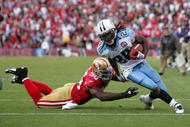 SAN FRANCISCO - NOVEMBER 08: Chris Johnson #28 of the Tennessee Titans gets past Parys Haralson #98 of the San Francisco 49ers on his way in to score a touchdown at Candlestick Park on November 8, 2009 in San Francisco, California. (Photo by Ezra Shaw/Getty Images)
