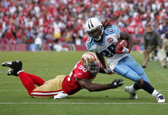 SAN FRANCISCO - NOVEMBER 08:  Chris Johnson #28 of the Tennessee Titans gets past Parys Haralson #98 of the San Francisco 49ers on his way in to score a touchdown at Candlestick Park on November 8, 2009 in San Francisco, California.  (Photo by Ezra Shaw/Getty Images)