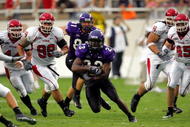 FORT WORTH, TX - SEPTEMBER 15:  Tailback Aaron Brown #23 of the Texas Christian University Horned Frogs runs against the Utah Utes on September 15, 2005 at Amon Carter Stadium in Fort Worth, Texas. TCU defeated Utah 23-20 in OT.  (Photo by Ronald Martinez/Getty Images)