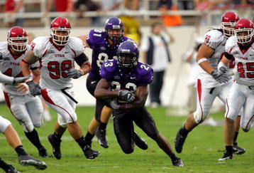 FORT WORTH, TX - SEPTEMBER 15:  Tailback Aaron Brown #23 of the Texas Christian University Horned Frogs runs against the Utah Utes on September 15, 2005 at Amon Carter Stadium in Fort Worth, Texas. TCU defeated Utah 23-20 in OT.  (Photo by Ronald Martinez/Getty Images)