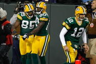 GREEN BAY, WI - NOVEMBER 1:  Wide receivers Donald Driver #80, Greg Jennings and quarterback Aaron Rogers #12 of the Green Bay Packers celebrate after a touchdown against the Minnesota Vikings at Lambeau Field on November 1, 2009 in Green Bay, Wisconsin. The Vikings defeated the Packers 38-26. (Photo by Scott Boehm/Getty Images)