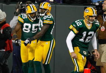 GREEN BAY, WI - NOVEMBER 1:  Wide receivers Donald Driver #80, Greg Jennings and quarterback Aaron Rogers #12 of the Green Bay Packers celebrate after a touchdown against the Minnesota Vikings at Lambeau Field on November 1, 2009 in Green Bay, Wisconsin. The Vikings defeated the Packers 38-26. (Photo by Scott Boehm/Getty Images)