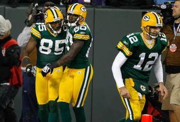 GREEN BAY, WI - NOVEMBER 1:  Wide receivers Donald Driver #80, Greg Jennings and quarterback Aaron Rogers #12 of the Green Bay Packers celebrate after a touchdown against the Minnesota Vikings at Lambeau Field on November 1, 2009 in Green Bay, Wisconsin. The Vikings defeated the Packers 38-26. (Photo by Scott Boehm/Getty Images)