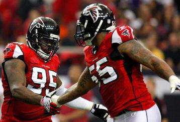 ATLANTA - NOVEMBER 08:  Jonathan Babineaux #95 and John Abraham #55 of the Atlanta Falcons celebrate a sack against the Washington Redskins at Georgia Dome on November 8, 2009 in Atlanta, Georgia.  (Photo by Kevin C. Cox/Getty Images)