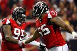 ATLANTA - NOVEMBER 08:  Jonathan Babineaux #95 and John Abraham #55 of the Atlanta Falcons celebrate a sack against the Washington Redskins at Georgia Dome on November 8, 2009 in Atlanta, Georgia.  (Photo by Kevin C. Cox/Getty Images)