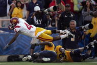 BERKELEY, CA - OCTOBER 03:  Joe McKnight #4 of the USC Trojans dives in to the endzone for a touchdown during their game against the California Golden Bears at California Memorial Stadium on October 3, 2009 in Berkeley, California.  (Photo by Ezra Shaw/Getty Images)