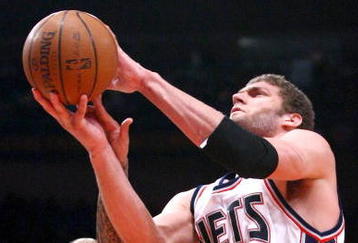 NEW YORK - MARCH 18: Brook Lopez #11 of the New Jersey Nets shoots over Wilson Chandler #21 of the New York Knicks at Madison Square Garden March 18, 2009 in New York City. NOTE TO USER: User expressly acknowledges and agrees that, by downloading and/or using this Photograph, User is consenting to the terms and conditions of the Getty Images License Agreement. (Photo by Chris McGrath/Getty Images)