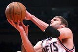 NEW YORK - MARCH 18: Brook Lopez #11 of the New Jersey Nets shoots over Wilson Chandler #21 of the New York Knicks at Madison Square Garden March 18, 2009 in New York City. NOTE TO USER: User expressly acknowledges and agrees that, by downloading and/or using this Photograph, User is consenting to the terms and conditions of the Getty Images License Agreement. (Photo by Chris McGrath/Getty Images)