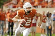 AUSTIN, TX - NOVEMBER 07: Quarterback Colt McCoy #12 of the Texas Longhorns rolls out against the UCF Knights on November 7, 2009 at Darrell K Royal - Texas Memorial Stadium in Austin, Texas. Texas won 35-3. (Photo by Brian Bahr/Getty Images)