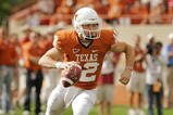 AUSTIN, TX - NOVEMBER 07:  Quarterback Colt McCoy #12 of the Texas Longhorns rolls out against the UCF Knights on November 7, 2009 at Darrell K Royal - Texas Memorial Stadium in Austin, Texas.  Texas won 35-3.  (Photo by Brian Bahr/Getty Images)