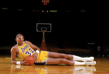Undated: Kareem Abdul- Jabbar of the Los Angeles Lakers poses for the camera as he lays on the court.  Mandatory Credit: Rick Stewart  /Allsport