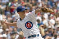 CHICAGO - JULY 26: Rich Harden #40 of the Chicago Cubs delivers the pitch during the game against the Cincinnati Reds on July 26, 2009 at Wrigley Field in Chicago, Illinois. (Photo by Jonathan Daniel/Getty Images) 