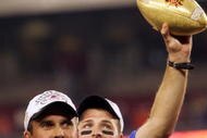 GLENDALE, AZ - JANUARY 1: Head coach Chris Petersen of the Boise State Broncos holds up the Fiesta Bowl football after defeating the Oklahoma Sooners 43-42 at the Tostito's Fiesta Bowl against the Boise State Broncos at University of Phoenix Stadium January 1, 2007 in Glendale, Arizona. (Photo by Jonathan Ferrey/Getty Images)