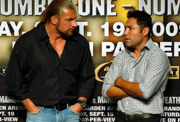 LAS VEGAS - SEPTEMBER 18:  WWE wrestler Triple H (L) and boxing promoter Oscar De La Hoya talk during the official weigh-in for boxers Floyd Mayweather Jr. and Juan Manuel Marquez at the MGM Grand Garden Arena September 18, 2009 in Las Vegas, Nevada. The two will fight at the MGM on September 19.  (Photo by Ethan Miller/Getty Images)