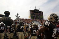 WEST LAFAYETTE, IN - SEPTEMBER 20:  The Purdue Boilermakers run on to the field before a game against the Central Michigan Chippewas at Ross-Ade Stadium on September 20, 2008 in West Lafayette, Indiana.  (Photo by Ronald Martinez/Getty Images)