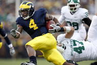 ANN ARBOR, MI - OCTOBER 25:  Brandon Minor #4 of the Michigan Wolverines tries to get around the tackle of Brandon Long #47 of the Michigan State Spartans during a third quarter run on October 25, 2008 at Michigan Stadium in Ann Arbor, Michigan. Michigan State won the game 35-21. (Photo by Gregory Shamus/Getty Images)