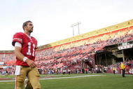 SAN FRANCISCO - NOVEMBER 08:  Alex Smith #11 of the San Francisco 49ers walks off the field after their loss to the Tennessee Titans at Candlestick Park on November 8, 2009 in San Francisco, California.  (Photo by Ezra Shaw/Getty Images)