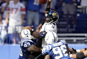 INDIANAPOLIS - SEPTEMBER 13:  David Garrard #9 of the Jacksonville Jaguars throws a pass while defended by Dwight Freeney #93,Gary Brackett #58 and Robert Mathis #98 of the Indianapolis Colts during the game at Lucas Oil Stadium on September 13, 2009 in Indianapolis, Indiana.  (Photo by Andy Lyons/Getty Images)