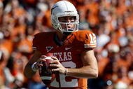 DALLAS - OCTOBER 17:  Quarterback Colt McCoy #12 of the Texas Longhorns drops back to pass against the Oklahoma Sooners at Cotton Bowl on October 17, 2009 in Dallas, Texas.  (Photo by Ronald Martinez/Getty Images)