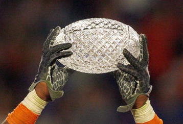 MIAMI - JANUARY 08:  Brandon Spikes #51 of the Florida Gators holds up the winning trophy after the FedEx BCS National Championship Game against the Oklahoma Sooners at Dolphin Stadium on January 8, 2009 in Miami, Florida.  (Photo by Eliot J. Schechter/Getty Images)
