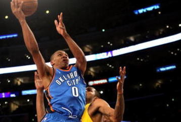 LOS ANGELES - FEBRUARY 10:  Russell Westbrook #0 of the Oklahoma City Thunder shoots over Trevor Ariza #3 of the Los Angeles Lakers on February 10, 2009 at Staples Center in Los Angeles, California.  The Lakers won 105-98.   NOTE TO USER: User expressly acknowledges and agrees that, by downloading and/or using this Photograph, user is consenting to the terms and conditions of the Getty Images License Agreement. (Photo by Stephen Dunn/Getty Images)