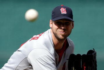 KANSAS CITY, MO - JUNE 20:  Starting pitcher Chris Carpenter #29 of the St. Louis Cardinals pitches just prior to the start of the game against the Kansas City Royals on June 20, 2009 at Kauffman Stadium in Kansas City, Missouri.  (Photo by Jamie Squire/Getty Images)