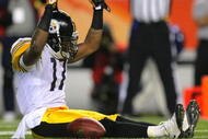DENVER - NOVEMBER 09: Mike Wallace #17 of the Pittsburgh Steelers celebrates after scoring a touchdown in the fourth quarter against the Denver Broncos at Invesco Field at Mile High on November 09, 2009 in Denver, Colorado. (Photo by Doug Pensinger/Getty Images)