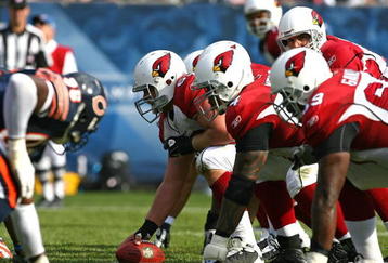 CHICAGO - NOVEMBER 08: Lyle Sendlein #63 of the Arizona Cardinals waits to snap the ball to Kurt Warner #13 against the Chicago Bears at Soldier Field on November 8, 2009 in Chicago, Illinois. The Cardinals defeated the Bears 41-21. (Photo by Jonathan Daniel/Getty Images)
