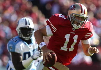 SAN FRANCISCO - NOVEMBER 08:  Alex Smith #11 of the San Francisco 49ers runs against the Tennessee Titans during an NFL game on November 8, 2009 at Candlestick Park in San Francisco, California.  (Photo by Jed Jacobsohn/Getty Images)