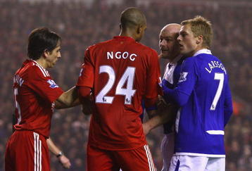 LIVERPOOL, ENGLAND - NOVEMBER 09:  David Ngog of Liverpool is confronted by Lee Carsley of Birmingham City after he won his side a penalty kick during the Barclays Premier League match between Liverpool and Birmingham City at Anfield on November 9, 2009 in Liverpool, England.  (Photo by Alex Livesey/Getty Images)