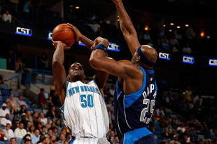 NEW ORLEANS - NOVEMBER 04:  Emeka Okafor #50 of the New Orleans Hornets makes a shot over Erick Dampier #25 of the  Dallas Mavericks at New Orleans Arena on November 4, 2009 in New Orleans, Louisiana.  The Hornets defeated the Mavericks 114-107.  NOTE TO USER: User expressly acknowledges and agrees that, by downloading and or using this photograph, User is consenting to the terms and conditions of the Getty Images License Agreement.  (Photo by Chris Graythen/Getty Images)