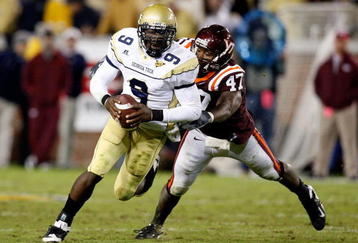 ATLANTA - OCTOBER 17:  Quarterback Josh Nesbitt #9 of the Georgia Tech Yellow Jackets rushes upfield away from Nekos Brown #47 of the Virginia Tech Hokies at Bobby Dodd Stadium on October 17, 2009 in Atlanta, Georgia.  (Photo by Kevin C. Cox/Getty Images)
