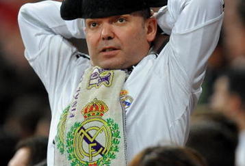 MADRID, SPAIN - NOVEMBER 10:  Real Madrid fan 'Tonin el Torero' reacts as he watches his team play during the Copa del Rey fourth round, second leg match between Real Madrid and AD Alcorcon at the Estadio Santiago Bernabeu on November 10, 2009 in Madrid, Spain. Real Madrid won the match 1-0 but got eliminated from the Copa del Rey by the third Division Spanish League team losing 4-1 on aggregate.  (Photo by Jasper Juinen/Getty Images)