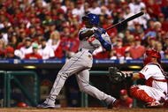 PHILADELPHIA - OCTOBER 21: Orlando Hudson #13 of the Los Angeles Dodgers connects for a home run in the fifth inning against the Philadelphia Phillies in Game Five of the NLCS during the 2009 MLB Playoffs at Citizens Bank Park on October 21, 2009 in Philadelphia, Pennsylvania. (Photo by Chris McGrath/Getty Images)