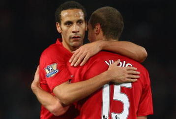 MANCHESTER, UNITED KINGDOM - DECEMBER 06:  Nemanja Vidic of Manchester United is embraced by Rio Ferdinand at the end of the Barclays Premier League match between Manchester United and Sunderland at Old Trafford on December 6, 2008 in Manchester, England.  (Photo by Jamie McDonald/Getty Images)
