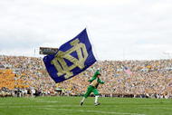 SOUTH BEND, IN - SEPTEMBER 17: The Notre Dame Fighting Irish mascot carries the school flag on the field before the game against the Michigan State Spartans on September 17, 2005 at Notre Dame Stadium in South Bend, Indiana. (Photo by Elsa/Getty Images)