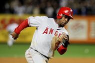NEW YORK - OCTOBER 25: Chone Figgins #9 of the Los Angeles Angels of Anaheim rounds third base to score in the top of the eighth inning against the New York Yankees in Game Six of the ALCS during the 2009 MLB Playoffs at Yankee Stadium on October 25, 2009 in the Bronx borough of New York City. (Photo by Nick Laham/Getty Images)