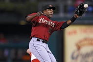 PHILADELPHIA - SEPTEMBER 30: Miguel Tejada #10 of the Houston Astros jumps to catch the ball as Shane Victorino #8 of the Philadelphia Phillies steals second base Astros at the Citizens Bank Park on September 30, 2009 in Philadelphia, Pennsylvania. (Photo by Drew Hallowell/Getty Images)