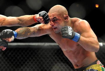 LAS VEGAS - JULY 11:  (L-R) Georges St. Pierre battles Thiago Alves during their welterweight title bout during UFC 100 on July 11, 2009 in Las Vegas, Nevada.  (Photo by Jon Kopaloff/Getty Images)