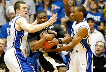 DURHAM, NC - FEBRUARY 22:  L.D. Williams #42 of the Wake Forest Demon Deacons is trapped by teammates Miles Plumlee #21 and Nolan Smith #2 of the Duke Blue Devils during their game at Cameron Indoor Stadium on February 22, 2009 in Durham, North Carolina.  (Photo by Streeter Lecka/Getty Images)