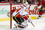 MONTREAL- NOVEMBER 10:  Miikka Kiprusoff #34 of the Calgary Flames watches the rebounding puck during the NHL game against the Montreal Canadiens on November 10, 2009 at the Bell Centre in Montreal, Quebec, Canada.  The Flames defeated the Canadiens 1-0.  (Photo by Richard Wolowicz/Getty Images)