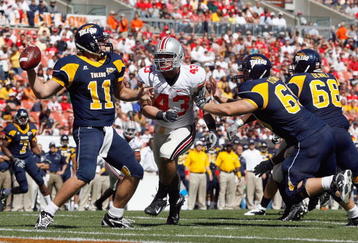 CLEVELAND - SEPTEMBER 19: Nathan Williams #43 of the Ohio State Buckeyes rushes quarterback Aaron Opelt #11 of the Toledo Rockets at Cleveland Browns Stadium on September 19, 2009 in Cleveland, Ohio. The Ohio State Buckeyes shutout the Toledo Rockets 38-0. (Photo by Gregory Shamus/Getty Images)