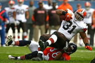 CHICAGO - NOVEMBER 01: Danieal Manning #38 of the Chicago Bears takes down Jamal Lewis #31 of the Cleveland Browns at Soldier Field on November 1, 2009 in Chicago, Illinois. The Bears defeated the Browns 30-6. (Photo by Jonathan Daniel/Getty Images)