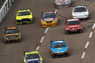 FORT WORTH, TX - NOVEMBER 08: Regan Smith, driver of the #78 Furniture Row Chevrolet, leads a group of cars during the NASCAR Sprint Cup Series Dickies 500 at Texas Motor Speedway on November 8, 2009 in Fort Worth, Texas. (Photo by Chris Graythen/Getty Images)
